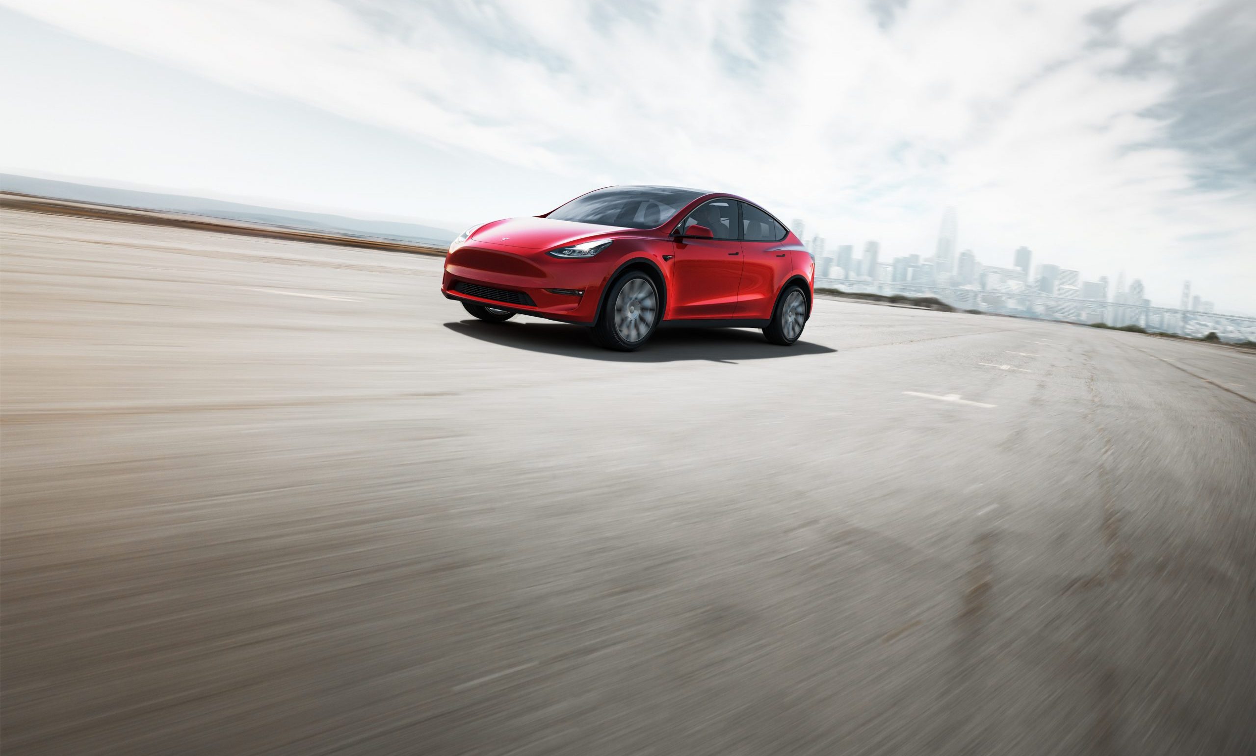 tesla model y in red