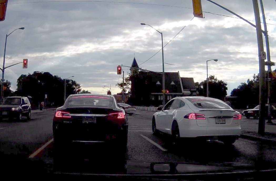 Two Tesla Model S face off at traffic light